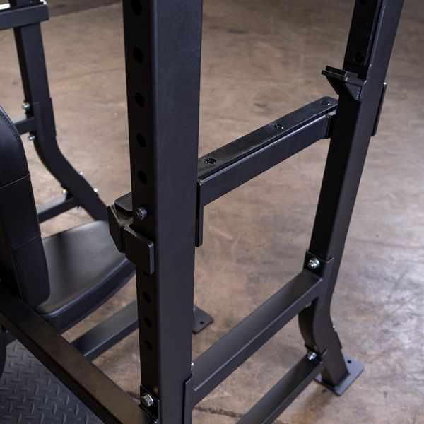 Olympic Shoulder Press Bench|Bench loaded with weights|In use|Safety crash bars|Seat back rest|Spotter Platform