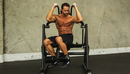 Athlete using machine showing obliques crunch exercise