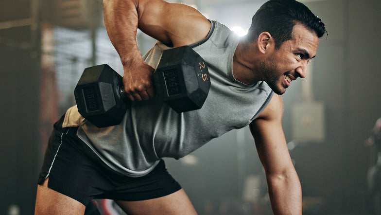 woman lifting dumbbell free weights