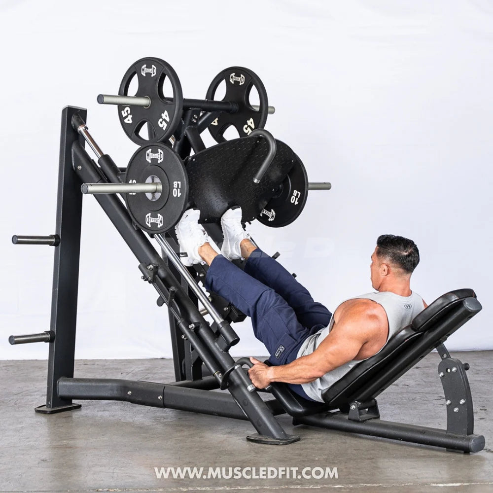 Person using the leg press machine with focus on calf raises