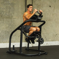 Athlete using machine - front side angle in crunch position