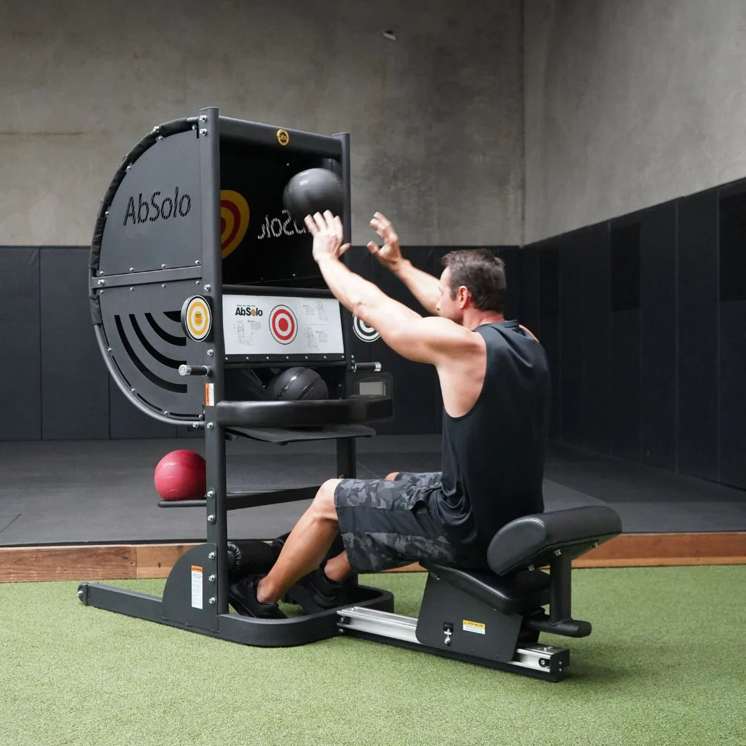 Machine in use by athlete shown bouncing ball off high target
