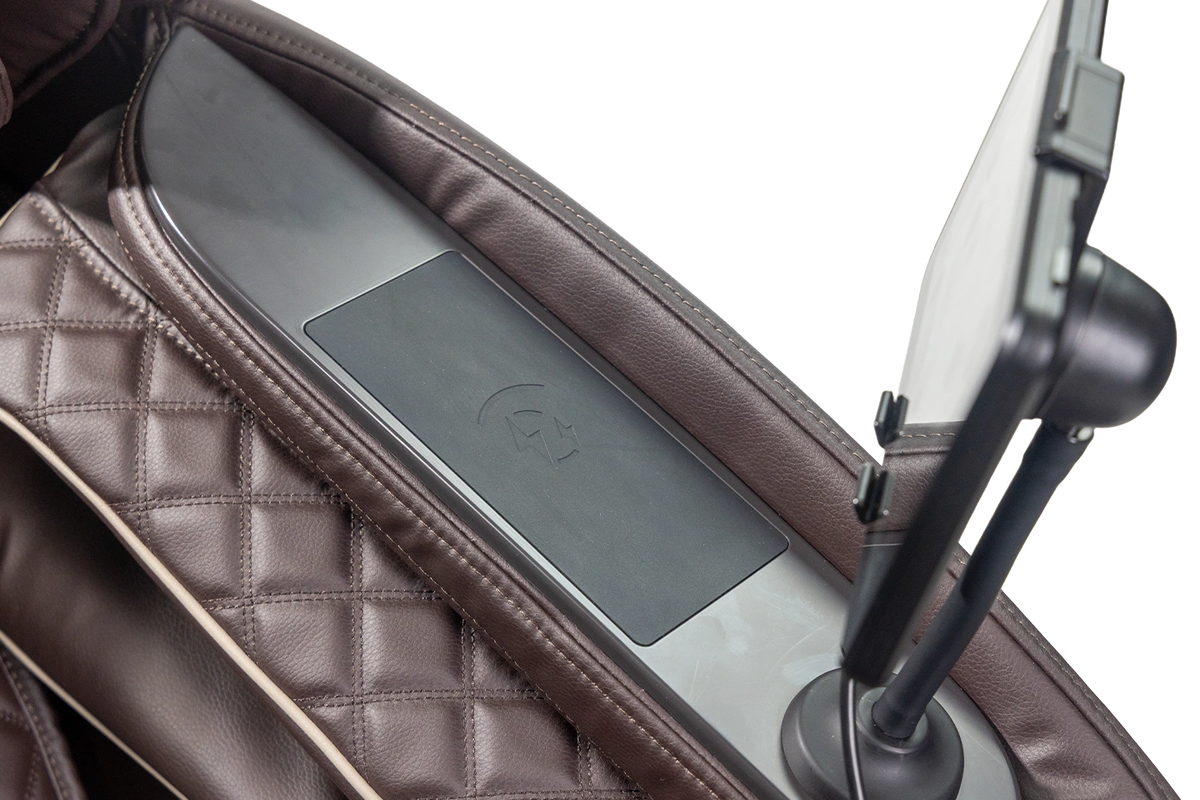 Close up of wireless charging pad on chair arm