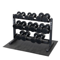 Rack loaded with round dumbbells