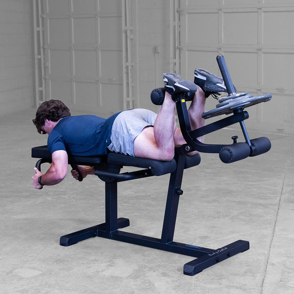Athlete using the suoine leg curl function