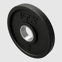 Closeup of 5lb rubber Olympic plate in color black with embossed logo and lb designation