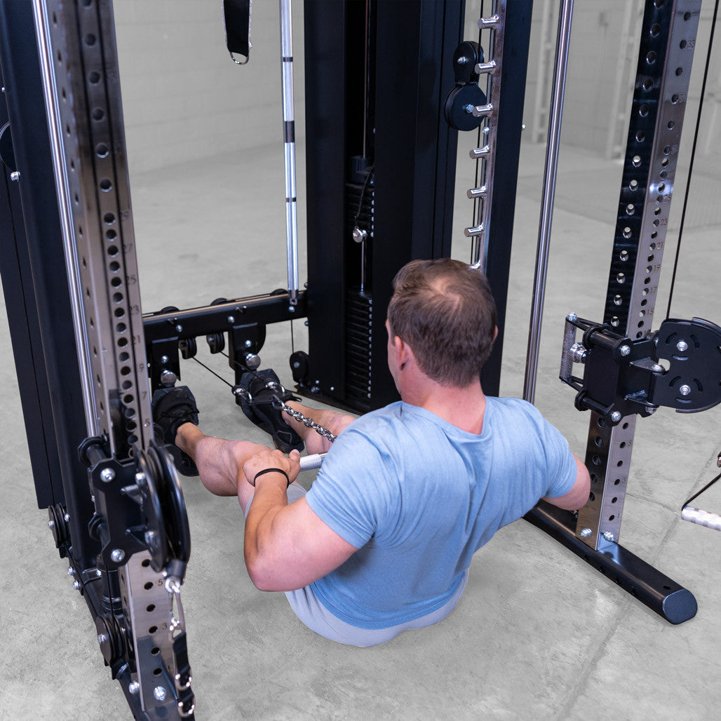 Male athlete performing low row exercise with included short straight bar