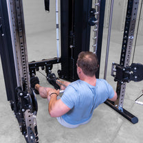 Male athlete performing low row exercise with included short straight bar