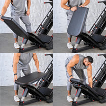 Athlete showing how to change machine to the hack sqiuat set up