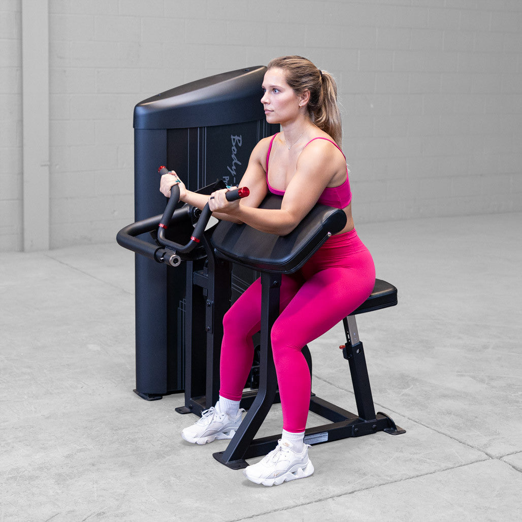 Bicep curl machine in use