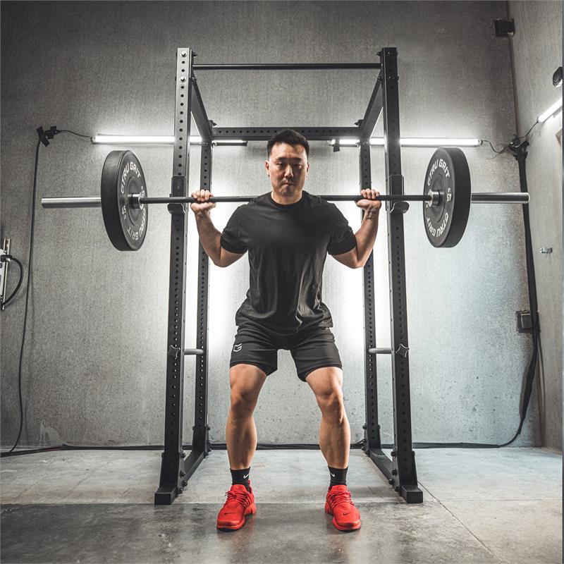 Flat Foot Power Rack Front|In use squat|In use resting|side view with spotter bars|Dip Bar Attachment|Spotter Arms