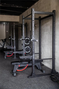 Flat Foot Power Rack Front|In use squat|In use resting|side view with spotter bars|Dip Bar Attachment|Spotter Arms