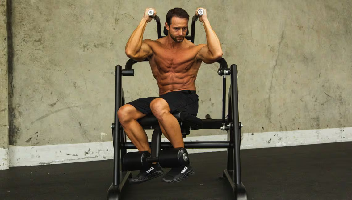 Athlete using machine showing obliques crunch exercise