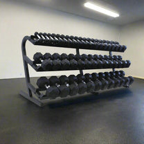 5-100lb dumbbell set with rack shown in gym setting