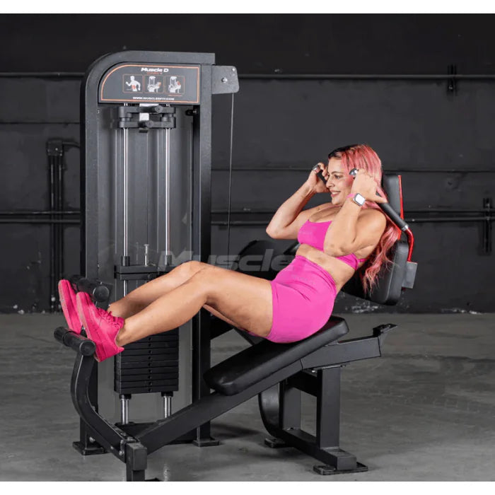 Athlete using machine shown in end position