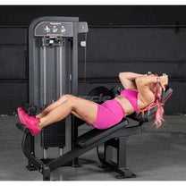 Athlete using machine shown in starting position