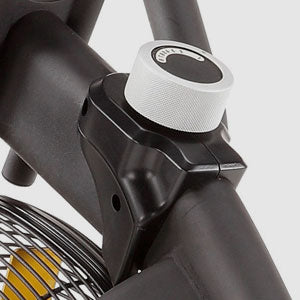 Close up of white colored adjustment know on black bike frame
