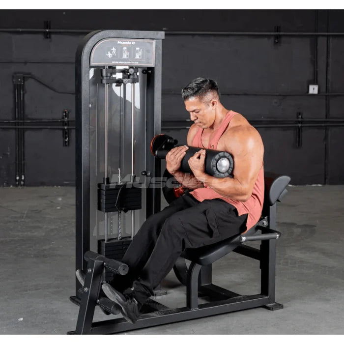 Athlete shown using machine in ab crunch position