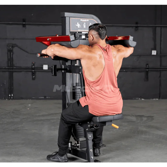 Athlete using machine shown in end position