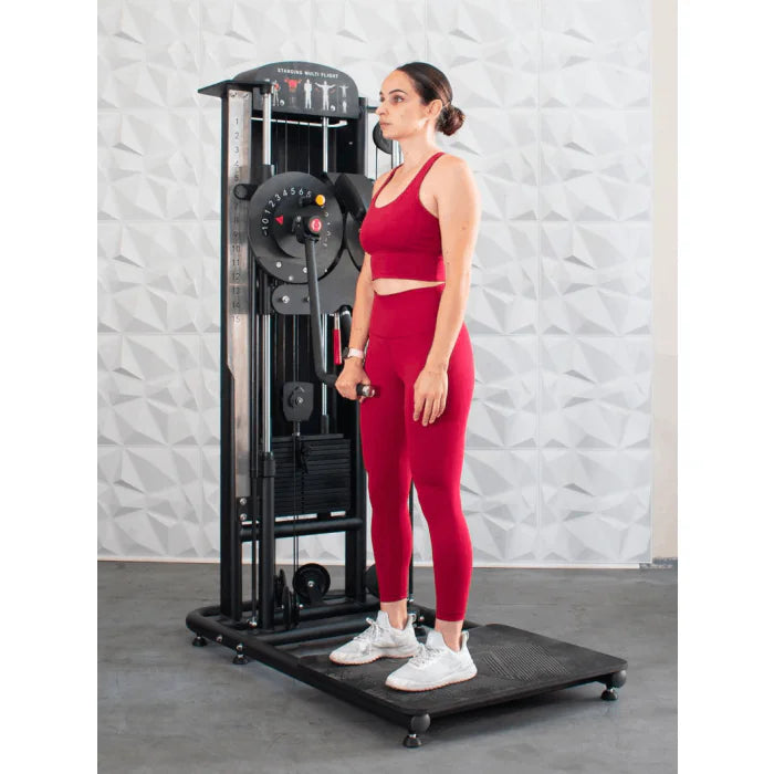 Athlete shown using machine for standing front shoulder raises