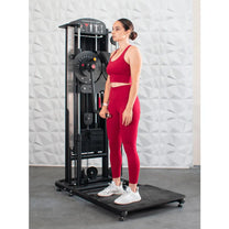 Athlete shown using machine for standing front shoulder raises