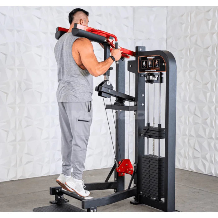 Athlete using machine in end position