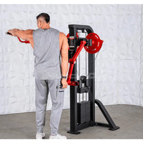 Athlete using machine for single arm side lateral raise